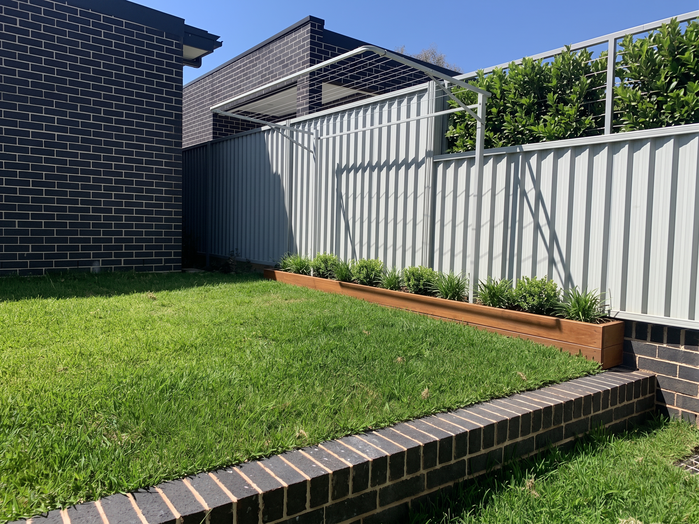 Modern house exterior with a ground mount clothesline